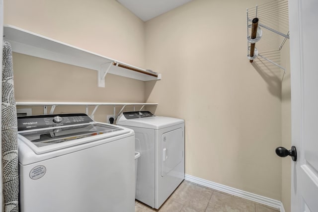 2112 Atlantic Ave, Anna, TX 75409 - laundry room featuring independent washer and dryer, light tile patterned floors, laundry area, and baseboards