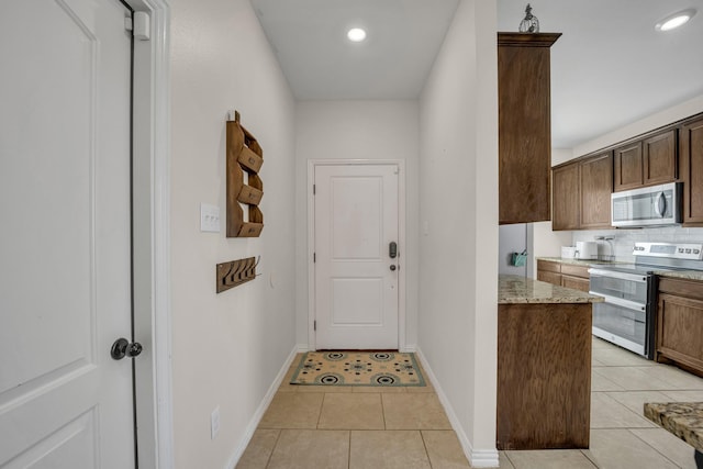 2112 Atlantic Ave, Anna, TX 75409 - entryway with light tile patterned flooring, baseboards, and recessed lighting