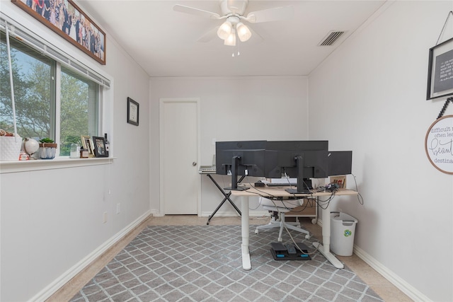 office featuring a ceiling fan and baseboards