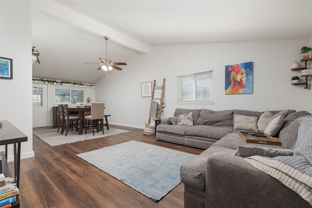 living area featuring dark wood-style flooring, a ceiling fan, and baseboards