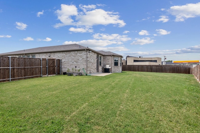 view of yard featuring a fenced backyard