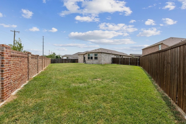 view of yard featuring a fenced backyard