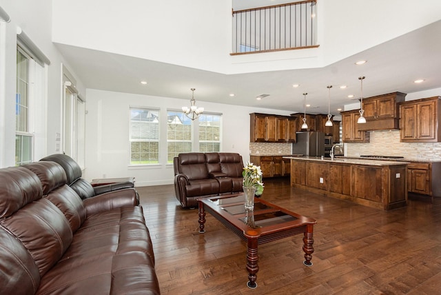 760 Durham St, Allen, TX 75013 - living area featuring a chandelier, dark wood-style flooring, recessed lighting, a high ceiling, and baseboards