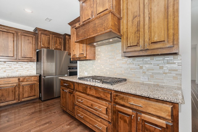 760 Durham St, Allen, TX 75013 - kitchen with stainless steel appliances, premium range hood, dark wood finished floors, decorative backsplash, and light stone counters