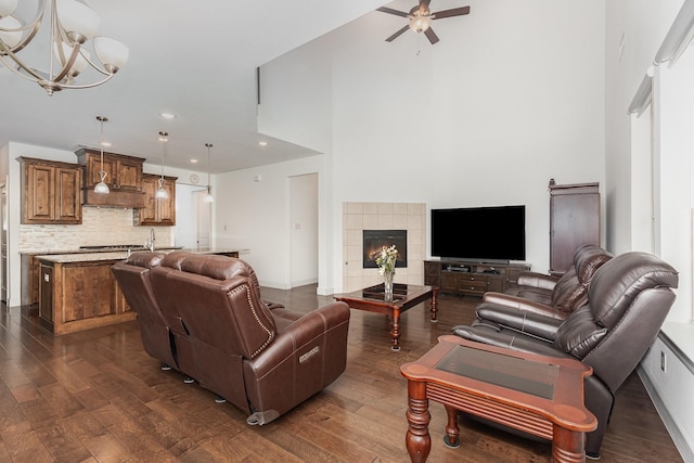 760 Durham St, Allen, TX 75013 - living area with dark wood-style flooring, a ceiling fan, recessed lighting, a chandelier, and a towering ceiling