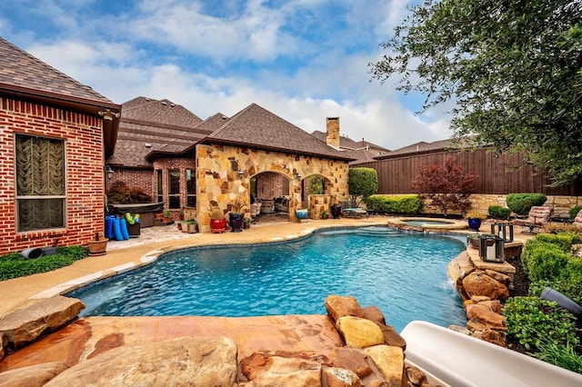 1000 Warren Dr, Prosper, TX 75078 - view of swimming pool with a patio and a pool with connected hot tub