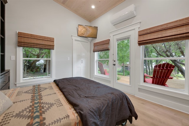 bedroom with light wood finished floors, access to exterior, an AC wall unit, wood ceiling, and high vaulted ceiling