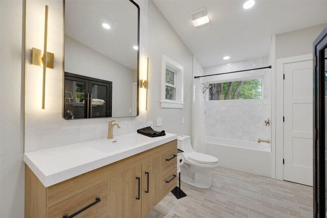 full bathroom with recessed lighting, backsplash, toilet, vanity, and shower / bath combo