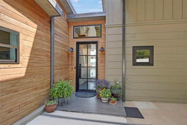 entrance to property featuring board and batten siding