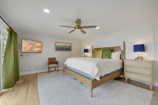 bedroom with recessed lighting, light wood finished floors, baseboards, and a ceiling fan