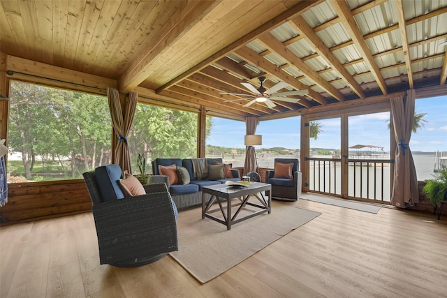 sunroom with an outdoor living space and ceiling fan
