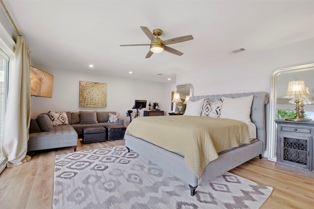 bedroom with ceiling fan, wood finished floors, visible vents, and recessed lighting