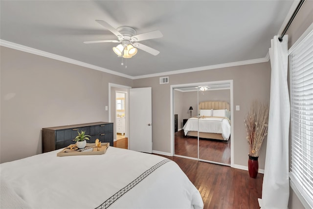 bedroom featuring a ceiling fan, wood finished floors, ornamental molding, and visible vents