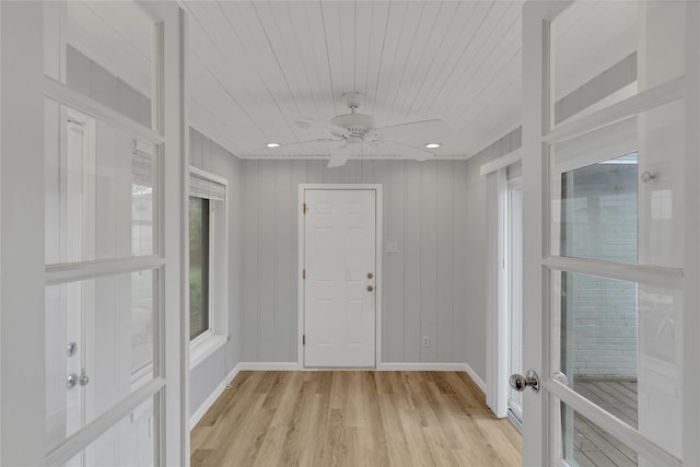 entrance foyer featuring wood ceiling, light wood-type flooring, baseboards, and a ceiling fan