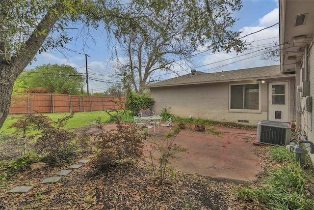 view of yard featuring a patio, cooling unit, and fence