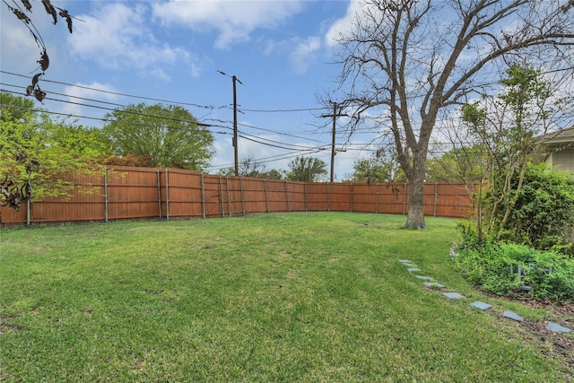 view of yard with a fenced backyard