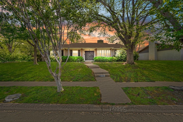 12256 Cox Ln, Dallas, TX 75244 - ranch-style home with a yard