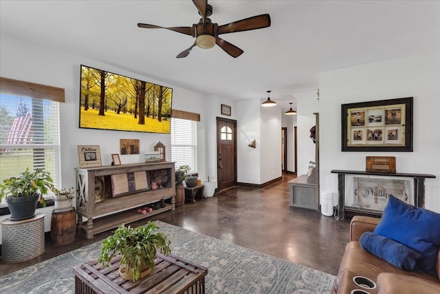 4024 County Road 2610, Bonham, TX 75418 - living room with concrete flooring and a ceiling fan