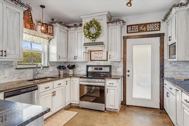 4024 County Road 2610, Bonham, TX 75418 - kitchen featuring appliances with stainless steel finishes, a sink, tasteful backsplash, dark stone counters, and pendant lighting