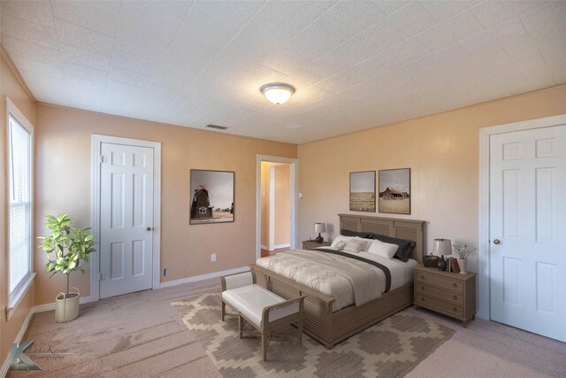 509 Reeves St, Clyde, TX 79510 - carpeted foyer with crown molding, a ceiling fan, visible vents, wood walls, and baseboards