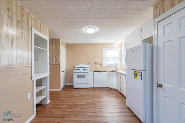 509 Reeves St, Clyde, TX 79510 - unfurnished dining area with wood finished floors, a notable chandelier, and baseboards