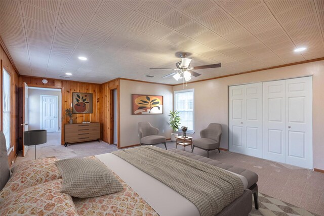 509 Reeves St, Clyde, TX 79510 - bedroom featuring recessed lighting, wood walls, baseboards, ornamental molding, and light colored carpet