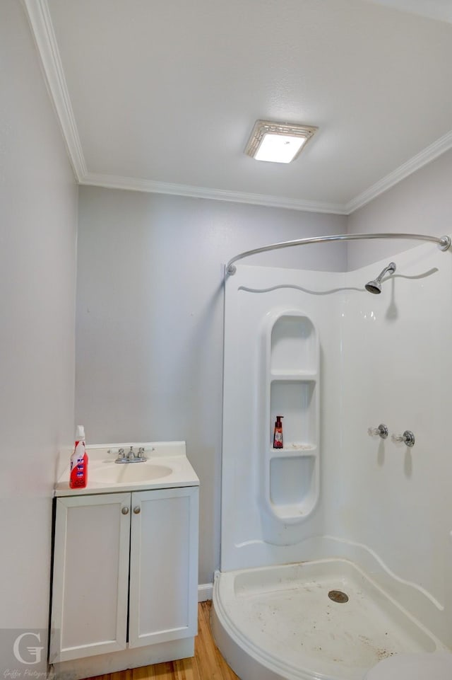 3132 Sandra Dr, Shreveport, LA 71119 - full bathroom featuring a shower stall, crown molding, and wood finished floors