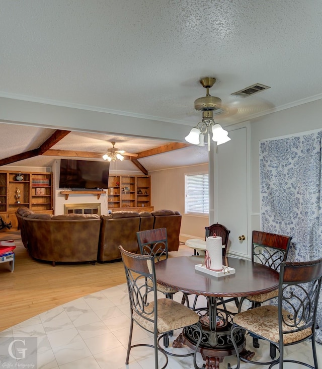 3132 Sandra Dr, Shreveport, LA 71119 - dining room with visible vents, a ceiling fan, light wood-style floors, and a textured ceiling