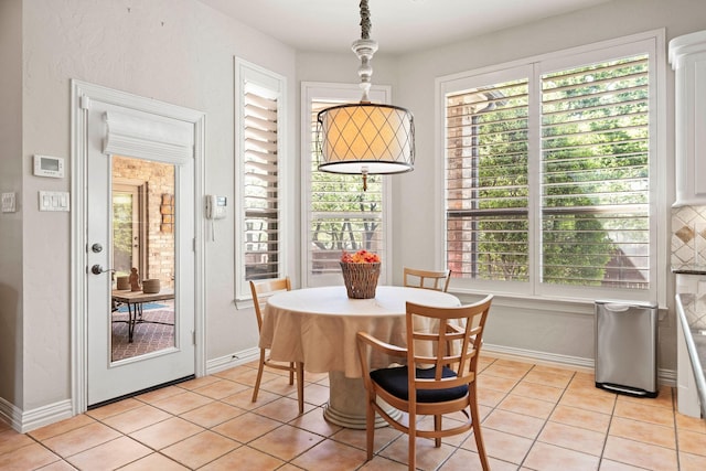 1406 Jacob Ave, Keller, TX 76248 - dining room featuring light tile patterned flooring, baseboards, and a wealth of natural light
