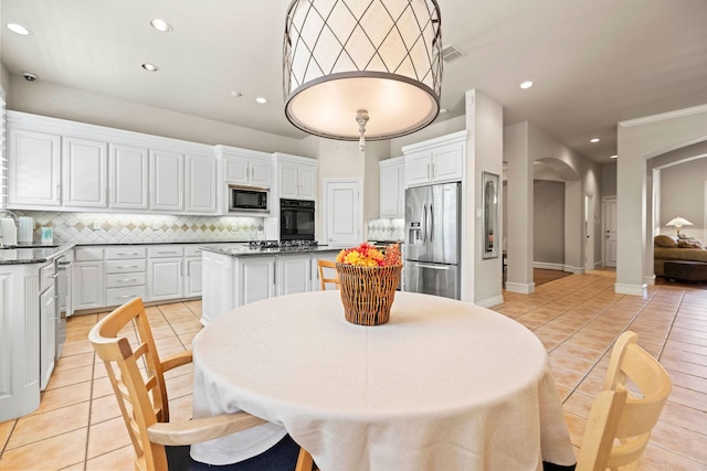 1406 Jacob Ave, Keller, TX 76248 - dining room featuring arched walkways, light tile patterned floors, visible vents, and recessed lighting