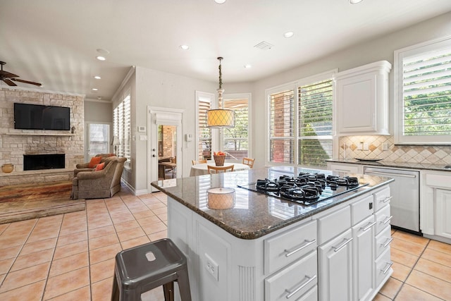 1406 Jacob Ave, Keller, TX 76248 - kitchen with black gas stovetop, open floor plan, dishwasher, and light tile patterned flooring