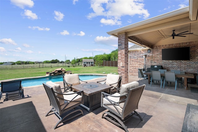 6611 Singleton Rd, Midlothian, TX 76065 - view of patio with ceiling fan, outdoor dining area, a storage shed, and an outbuilding