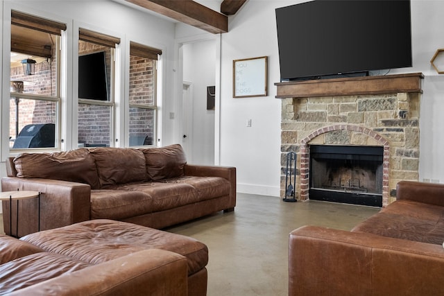 6611 Singleton Rd, Midlothian, TX 76065 - living area featuring finished concrete floors, a stone fireplace, and baseboards