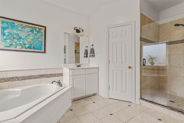 1870 Hillcroft Dr, Rockwall, TX 75087 - bathroom with tile patterned floors, a bath, vanity, and a stall shower