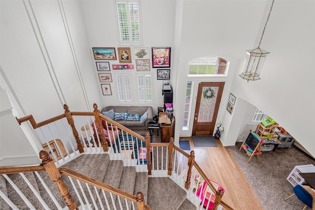 1870 Hillcroft Dr, Rockwall, TX 75087 - entrance foyer with a wealth of natural light, wood finished floors, a towering ceiling, and stairs