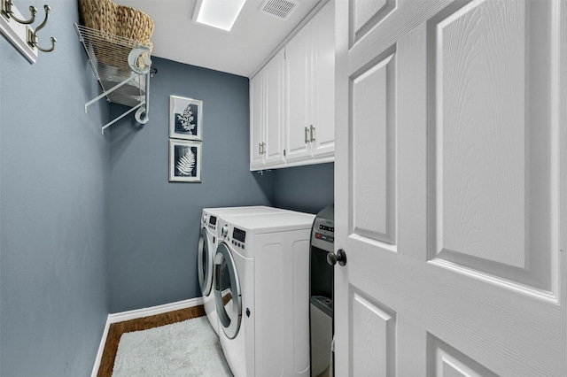 1346 Kiowa Dr E, Lake Kiowa, TX 76240 - laundry area featuring visible vents, wood finished floors, baseboards, cabinet space, and washer and clothes dryer