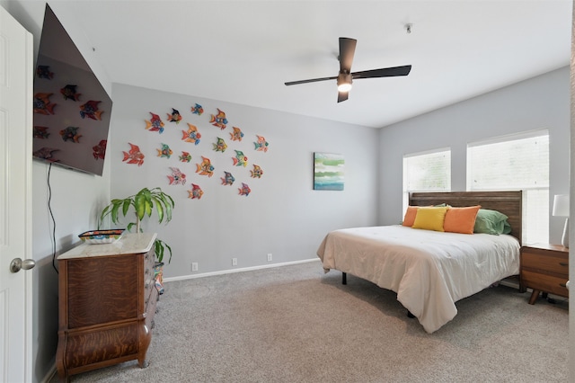 bedroom with light carpet, baseboards, and ceiling fan