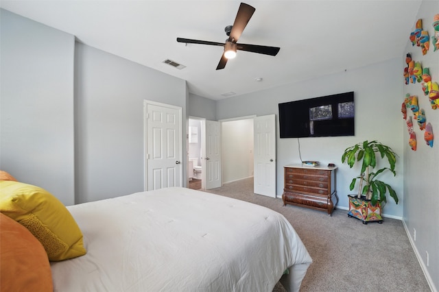 carpeted bedroom with visible vents, ceiling fan, and baseboards