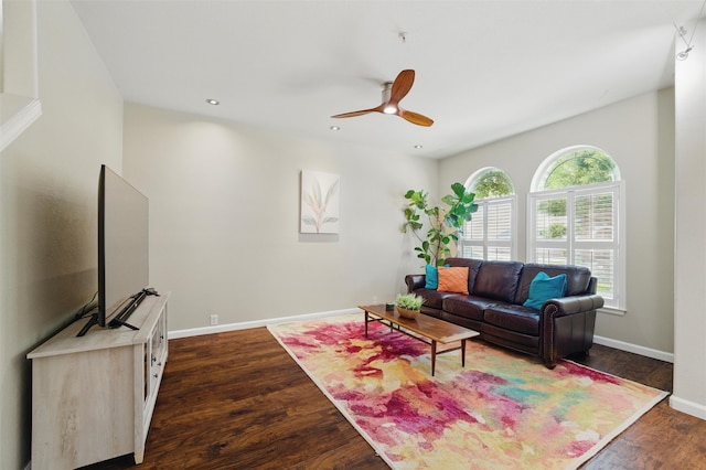 living room with baseboards, a ceiling fan, dark wood-type flooring, and recessed lighting