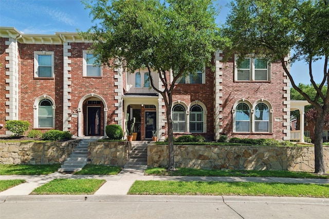 multi unit property featuring brick siding