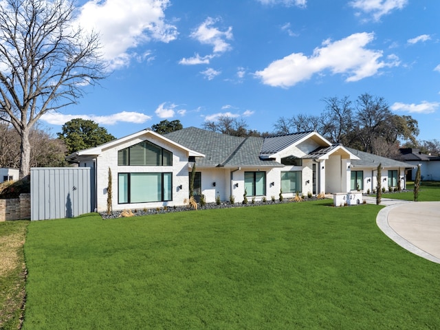 4147 Deep Valley Dr, Dallas, TX 75244 - view of front of house with brick siding, driveway, and a front lawn