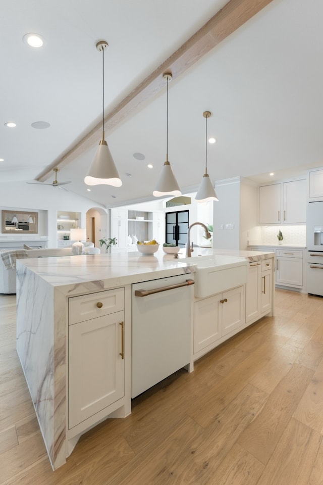 4147 Deep Valley Dr, Dallas, TX 75244 - kitchen featuring a sink, white appliances, open floor plan, a large island with sink, and vaulted ceiling with beams