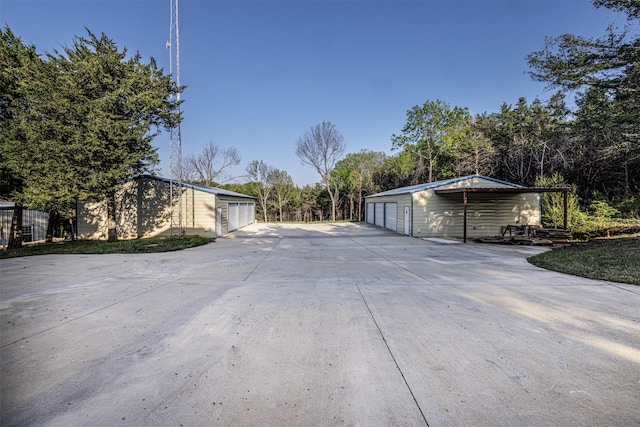 view of street with concrete driveway