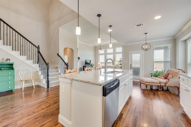 781 Bosley Dr, Fate, TX 75087 - kitchen featuring stainless steel dishwasher, a sink, dark wood-style flooring, ornamental molding, and white cabinets