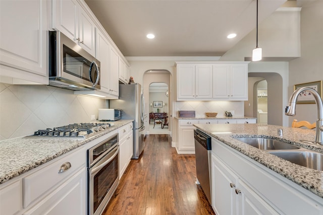 781 Bosley Dr, Fate, TX 75087 - kitchen featuring stainless steel appliances, arched walkways, a sink, white cabinets, and recessed lighting