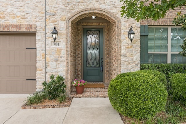 781 Bosley Dr, Fate, TX 75087 - view of exterior entry with stone siding and a garage