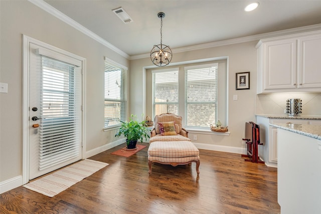 781 Bosley Dr, Fate, TX 75087 - living area featuring a chandelier, dark wood finished floors, baseboards, crown molding, and recessed lighting
