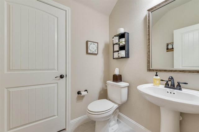 781 Bosley Dr, Fate, TX 75087 - bathroom with baseboards, toilet, a sink, and tile patterned floors