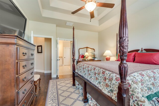 781 Bosley Dr, Fate, TX 75087 - bedroom with a tray ceiling, wood finished floors, baseboards, and ceiling fan