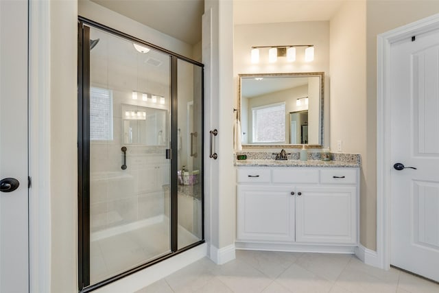 781 Bosley Dr, Fate, TX 75087 - bathroom with a stall shower, tile patterned floors, vanity, and baseboards